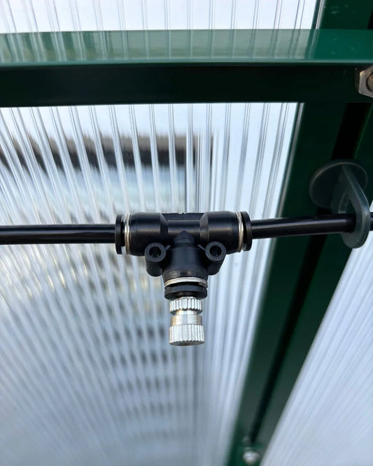 Greenhouse misting nozzle on UV-protected polycarbonate panel with aluminium frame