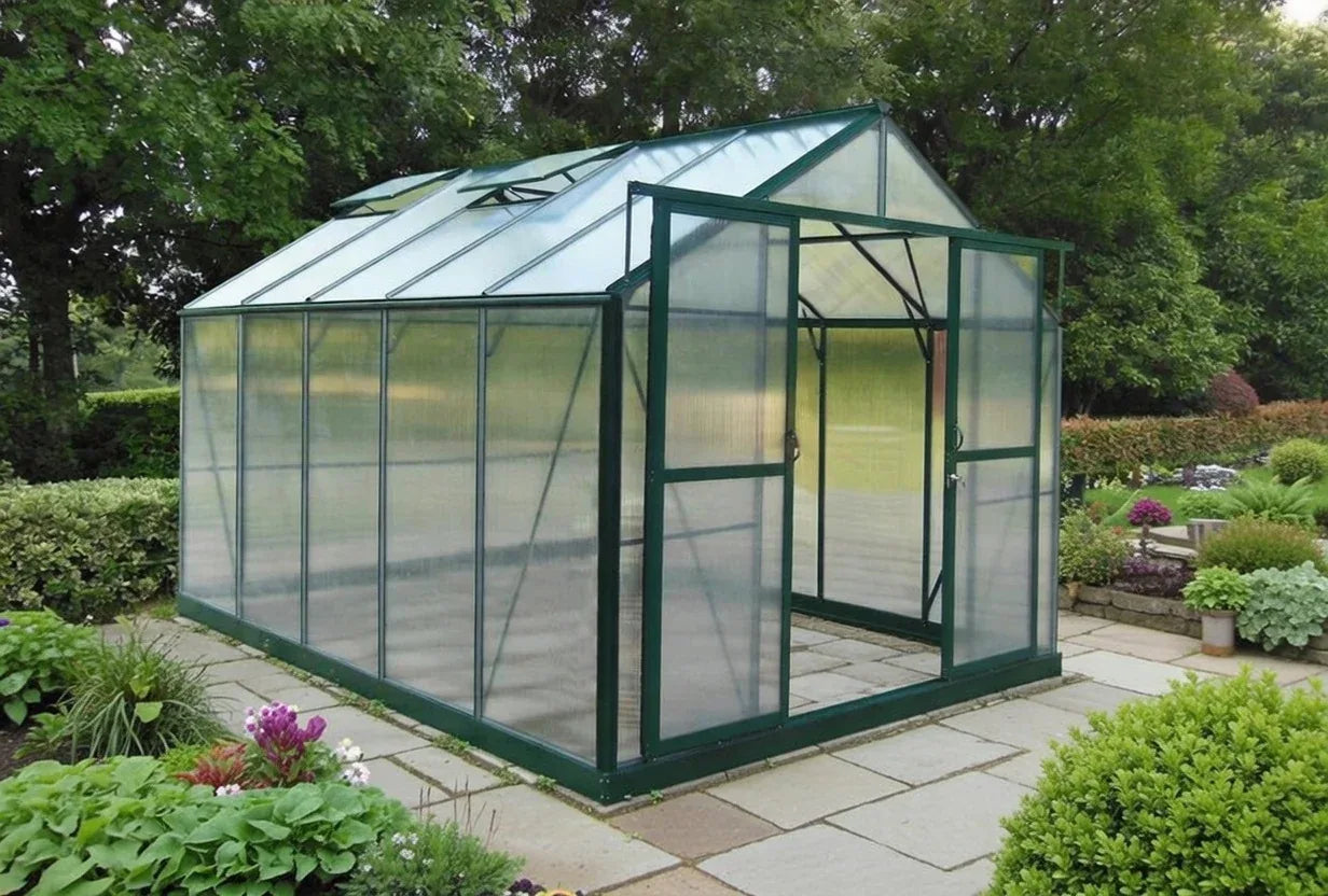 Aluminium-frame greenhouse with polycarbonate panels in a garden setting