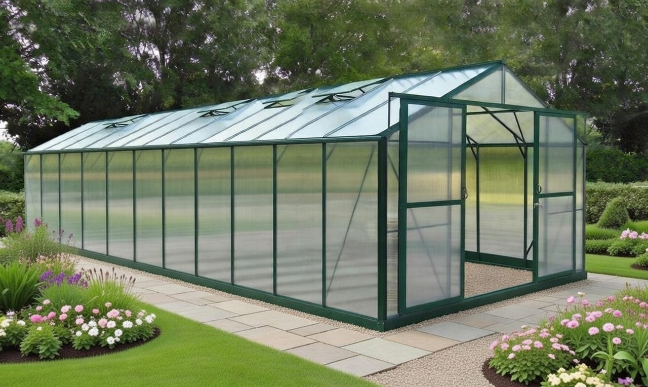 Large polycarbonate greenhouse with green aluminium frame in a landscaped garden