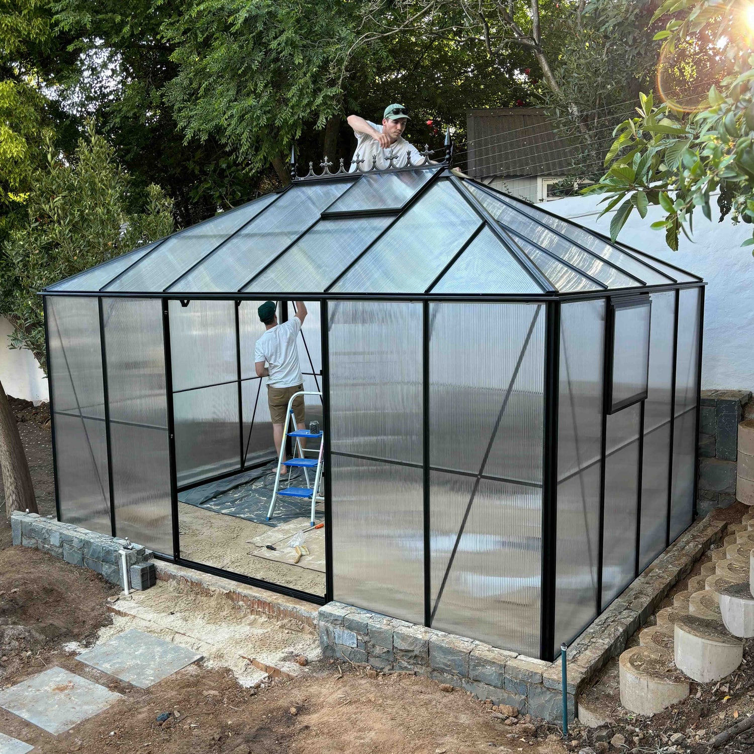 Easy Greenhouse team assembling the Luxe Gro greenhouse